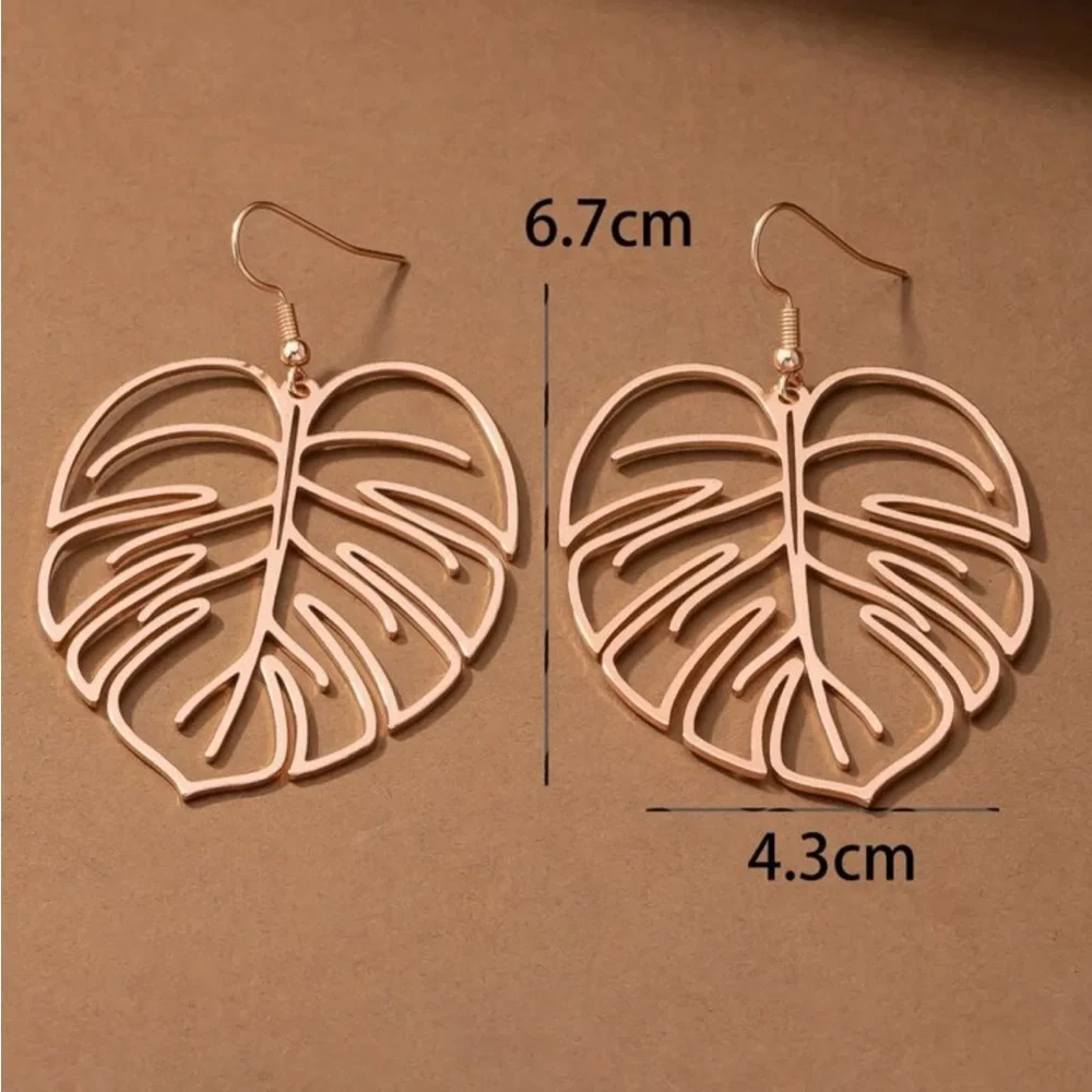 Golden Monstera Leaf Holographic Cut-out Dangle Earrings - Picture 4 of 4